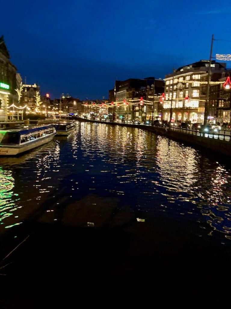 Jordaan Amsterdam at night with boats and lights 
